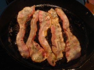Bacon cooking photo by Flickr user robotsari